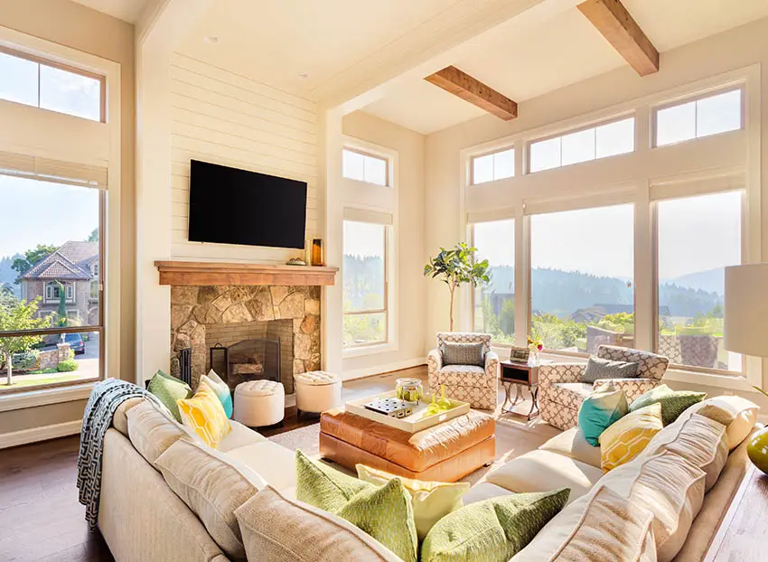 Living room with modern transom windows wood beams