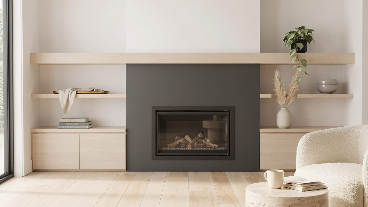 Pale oak mantel spanning low cabinets and open display shelves either side