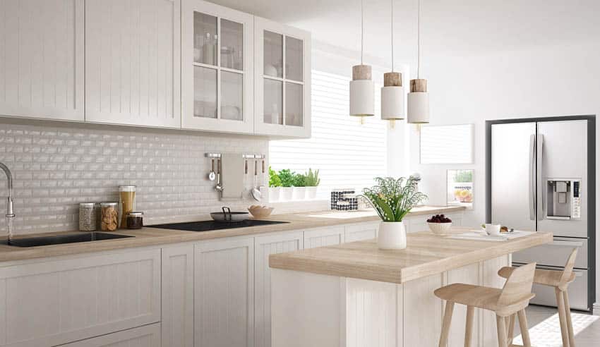 Scandinavian style kitchen with subway tile and wood countertops
