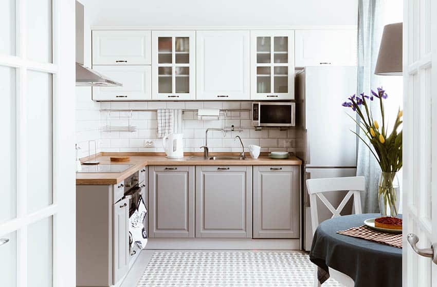 Small kitchen with gray white chalk painted cabinets