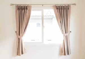 Window with apron length curtains