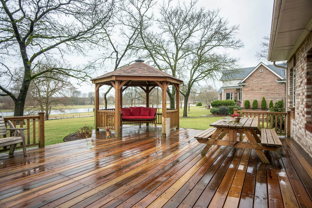 12 foot cedar octagon gazebo next to wood deck