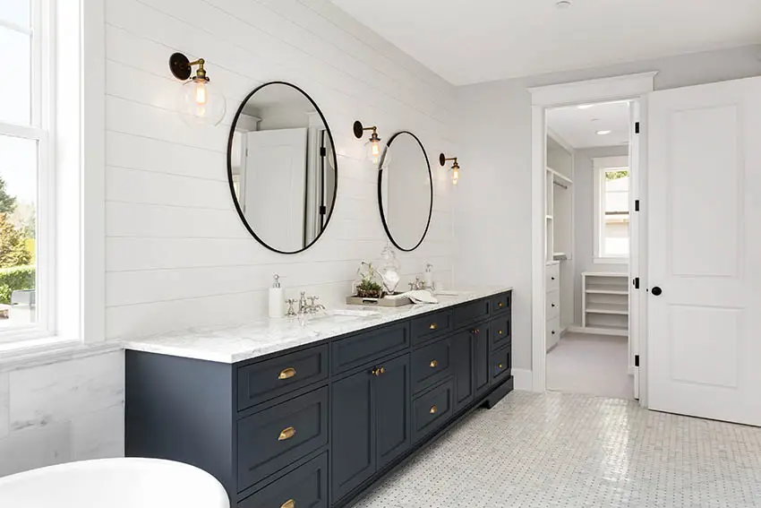 Bathroom door and large vanity with double mirrors