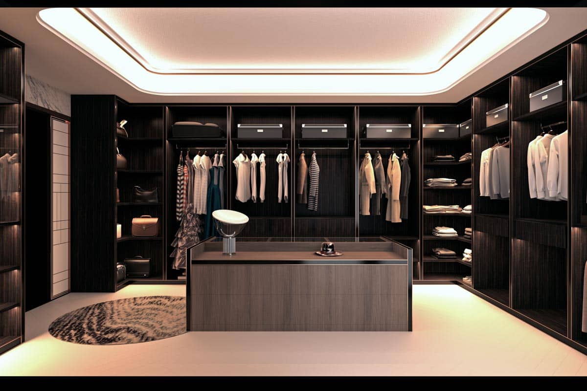 closet with island and lighting fixtures