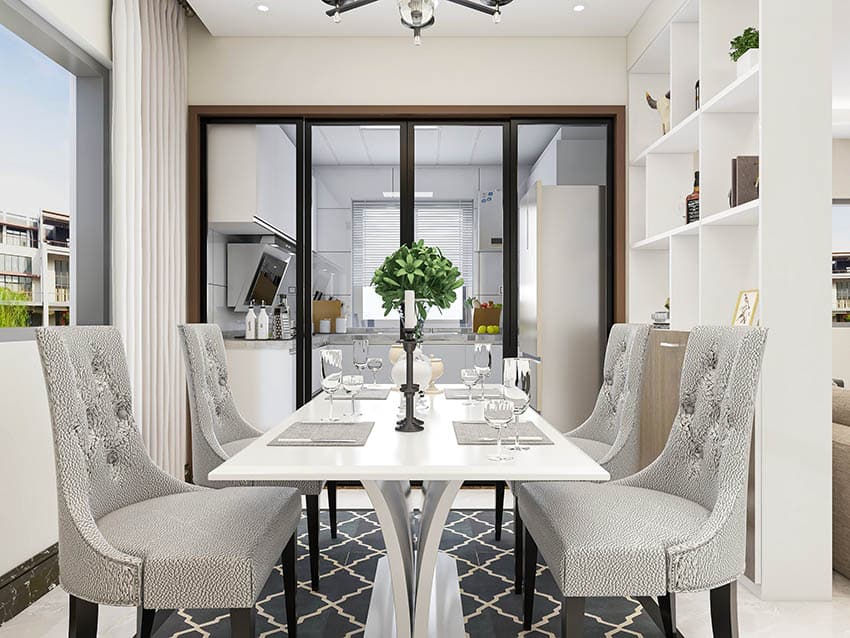 Contemporary design table with wingback gray chairs and area rug