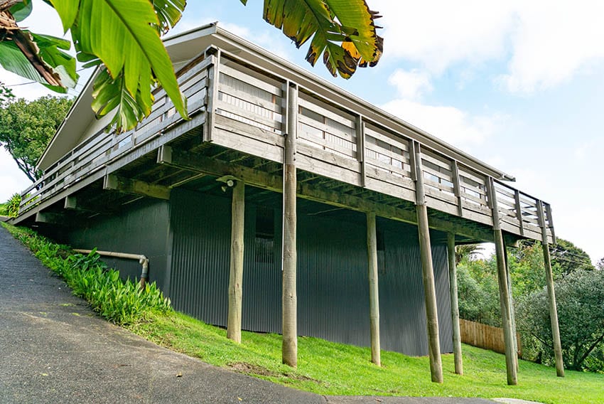 Corrugated metal panels underneath deck