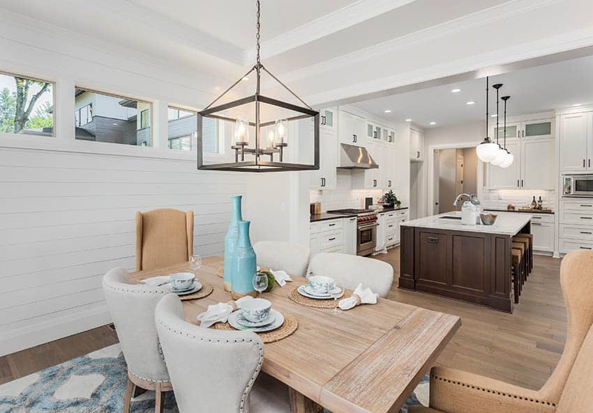 Table with brown arm chairs and blue jars