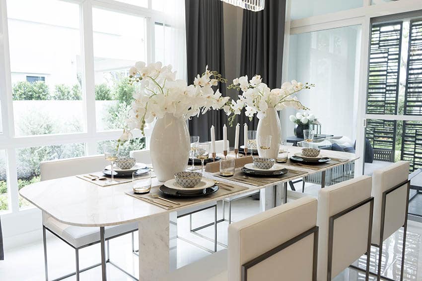 Double pedestal table with white vase arrangement