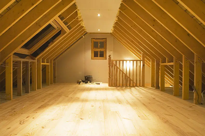 Exposed wood rafters with attic space