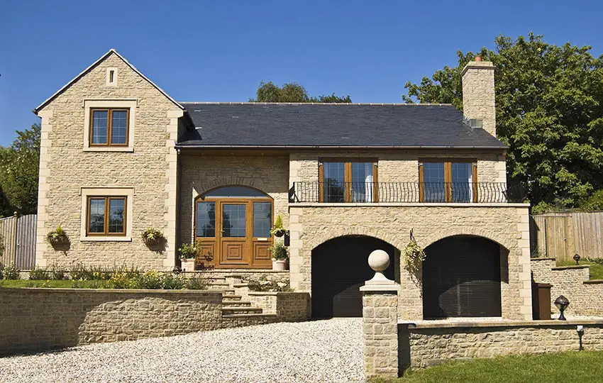 Stone cladding on exterior of home with driveway