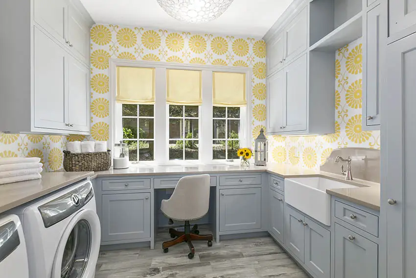 Gray cabinet laundry room with yellow wallpaper