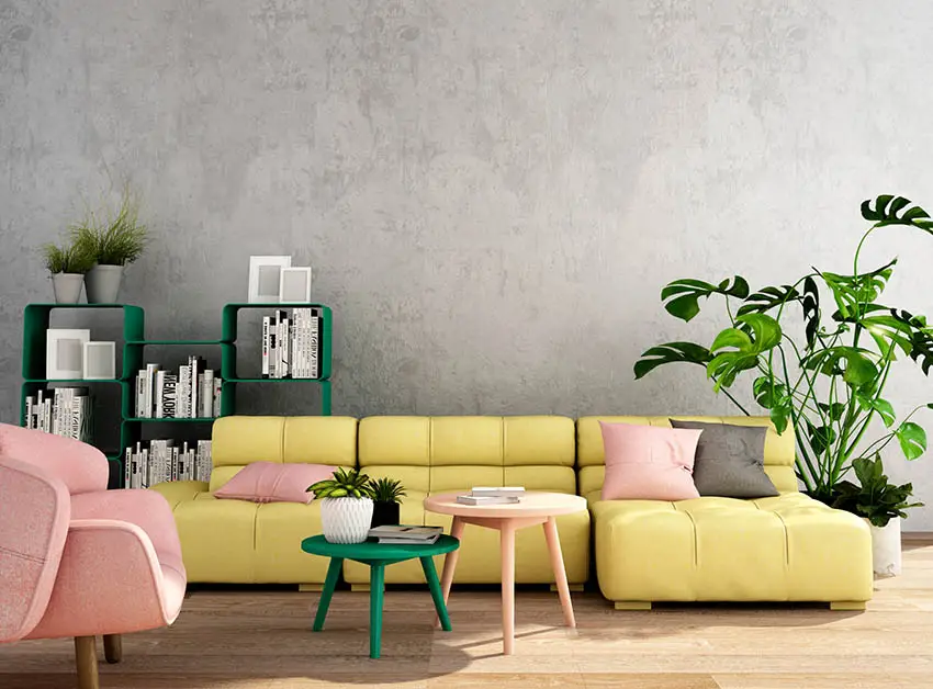 Gray living room with yellow couch pink pillows
