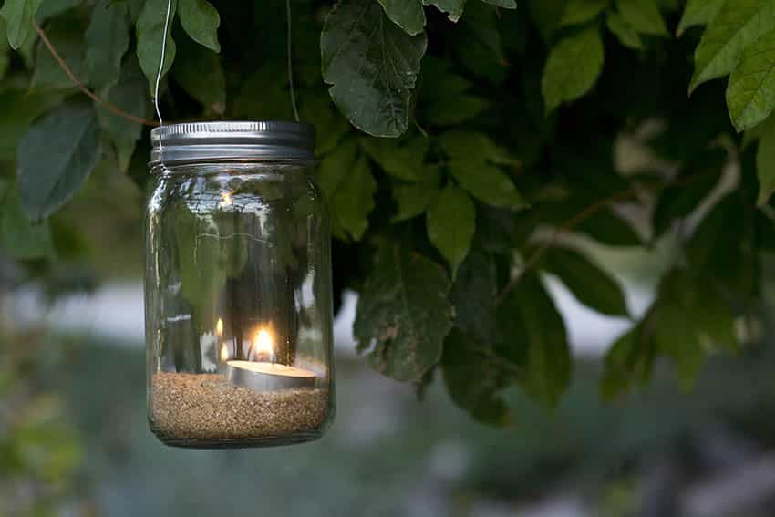 Hanging mason jar candle light with sand