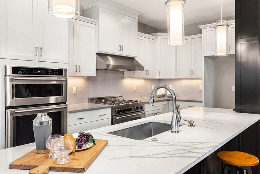 Kitchen with calacatta quartz countertop island grey quartz counters white shaker