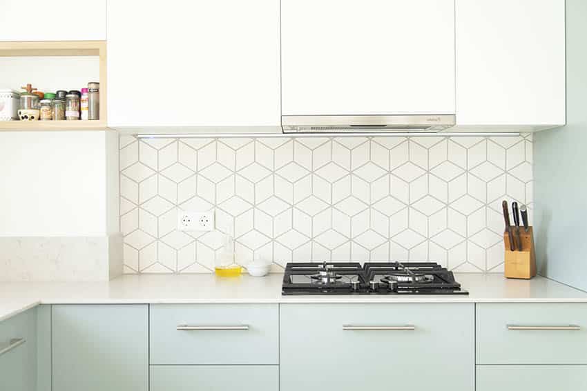 Kitchen with gas cooktop geometric tile backsplash