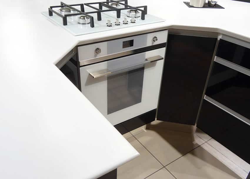 Kitchen with white solid surface corian countertops