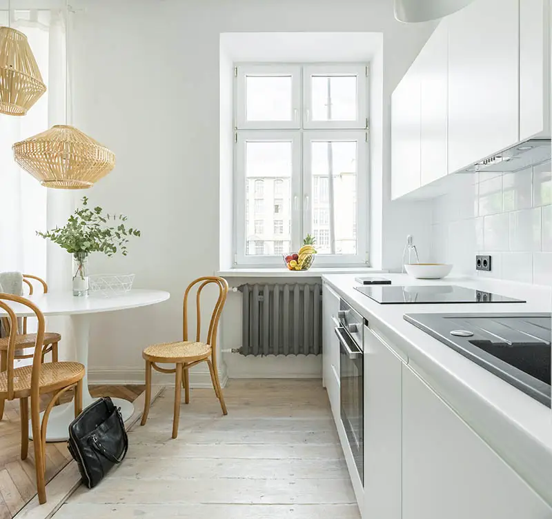 Kitchen with white washed wood flooring