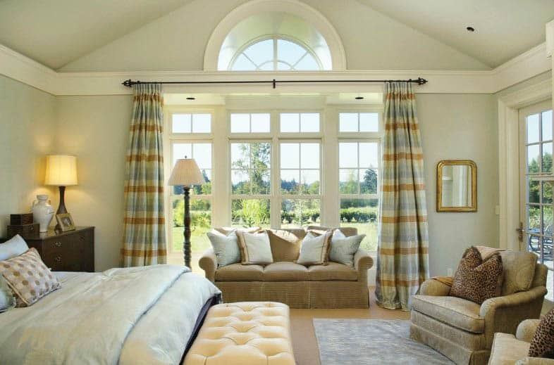 Master bedroom with large french windows transom window cathedral ceiling