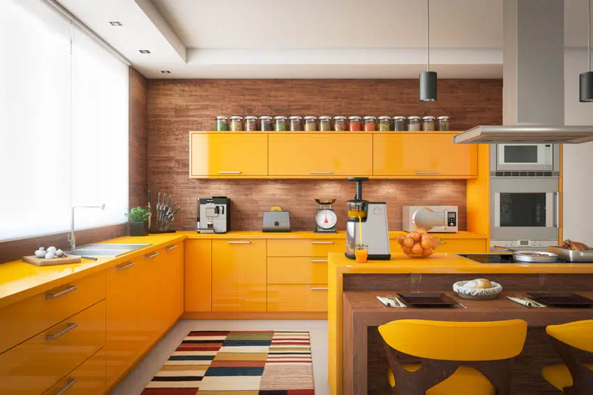 Orange kitchen cabinets appliances oven dining area