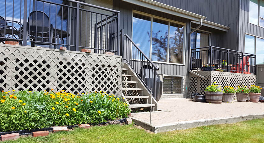 Painted backyard deck with lattice skirting