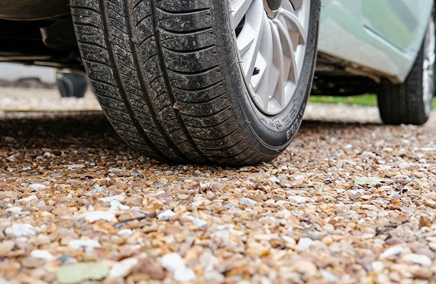 Car over pea gravel driveway