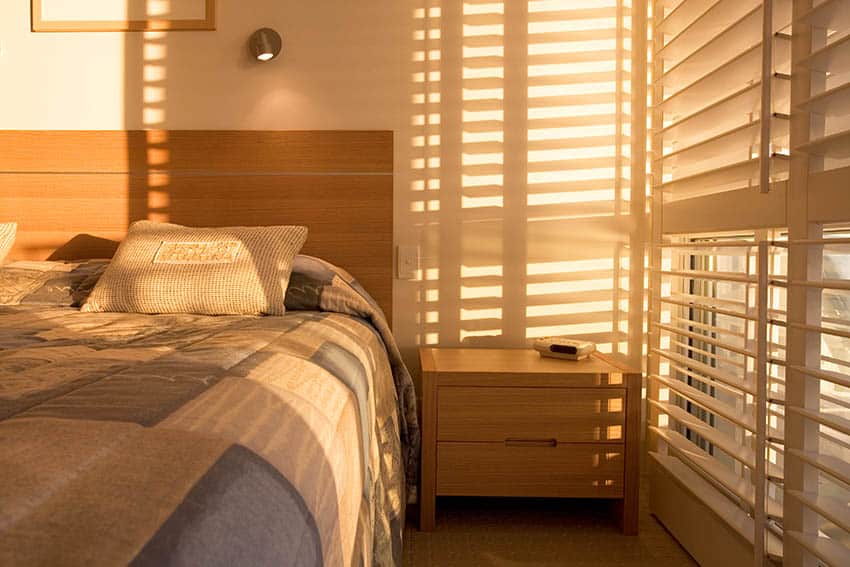 Plantation shutters in bedroom