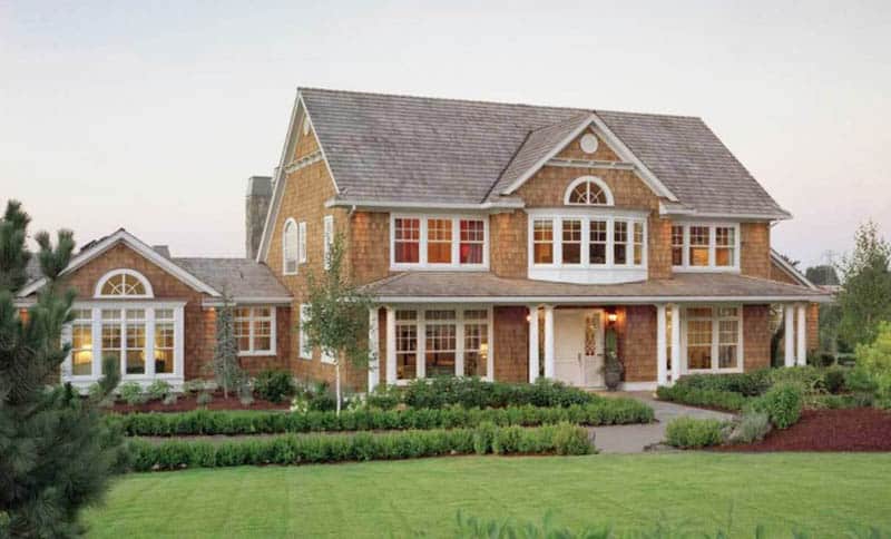Shingle style house plan with white framed windows