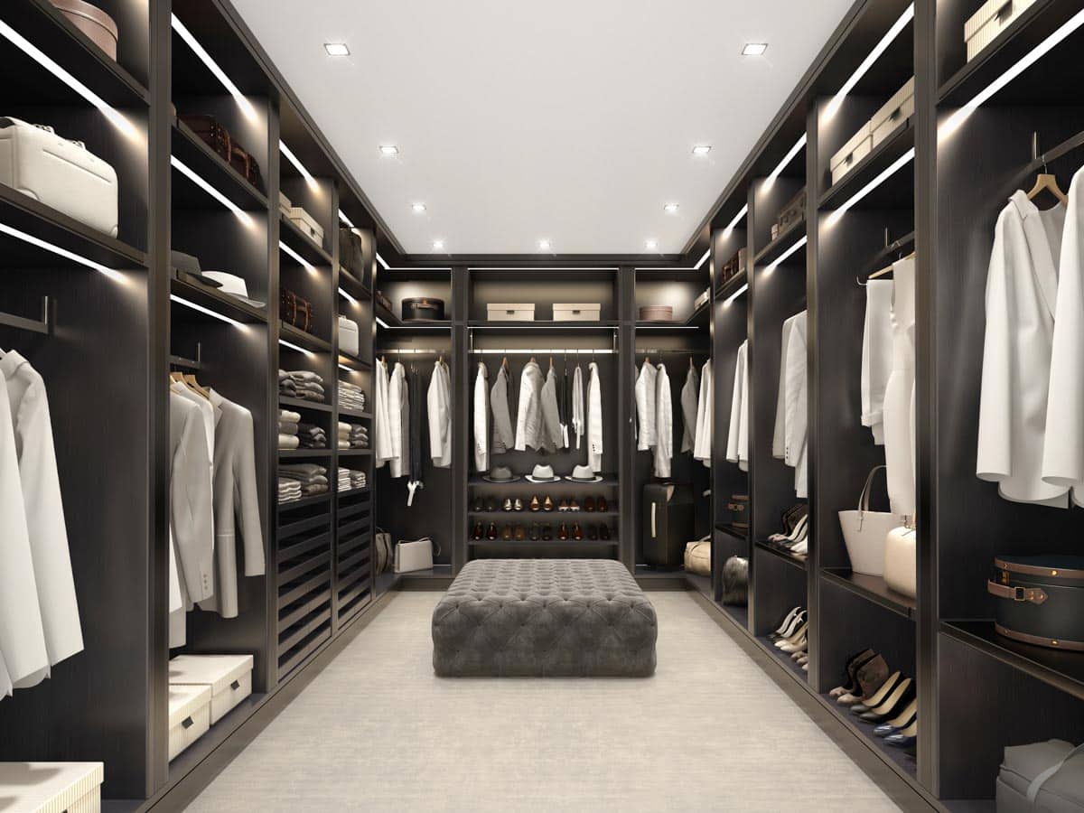 spacious closet with ottoman pouf