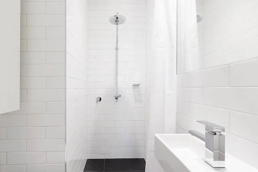 White tile shower bathroom