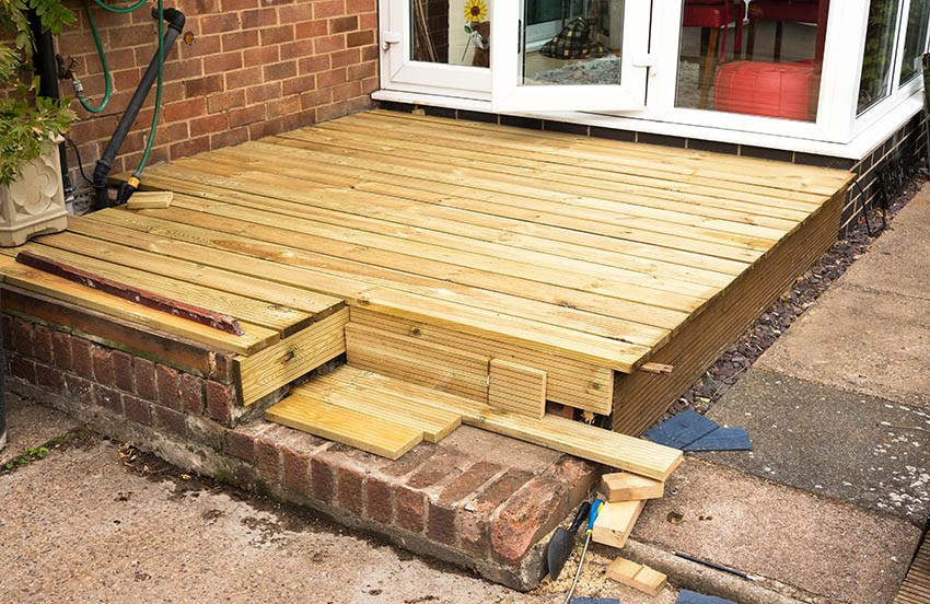 Wooden deck with brick border skirting