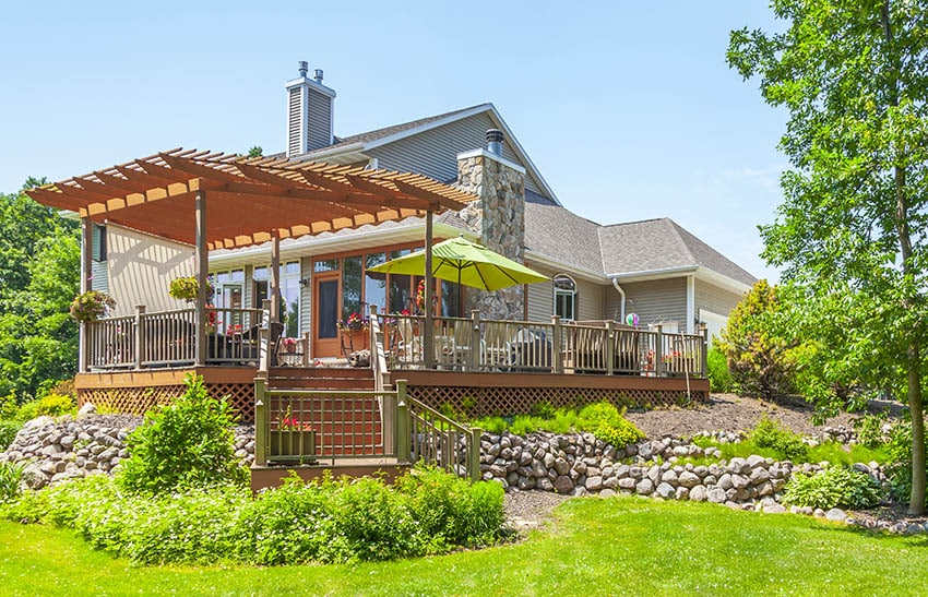 Wood deck with lattice skirting and pergola design