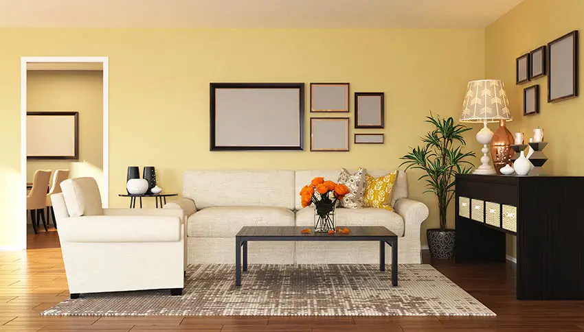 Yellow living room with white couches