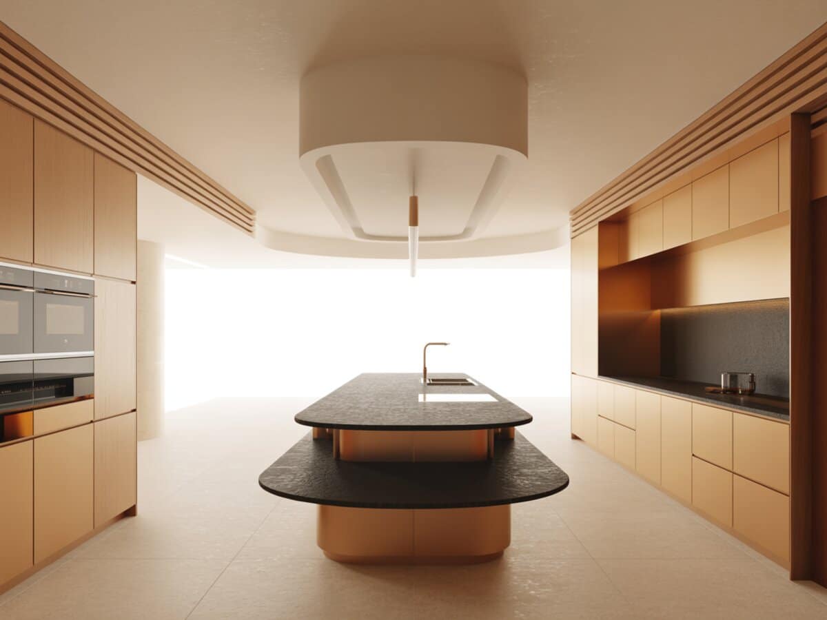 Pale wood cabinets surround a curved bi-level island topped in dark stone