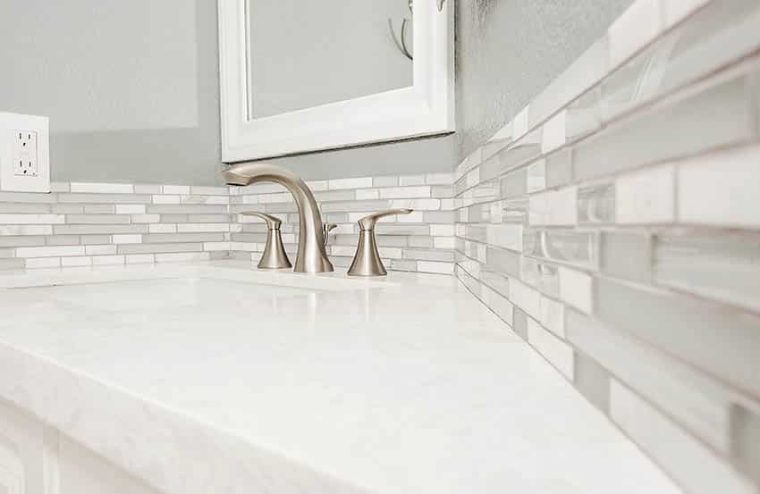 Bathroom with brushed nickel faucet