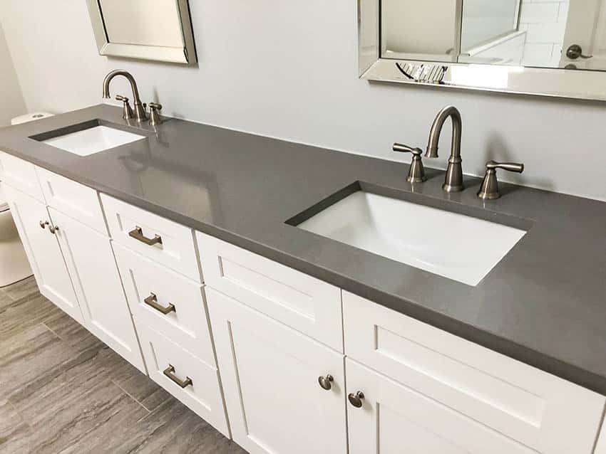 Bathroom with gray solid surface countertop vanity double sink