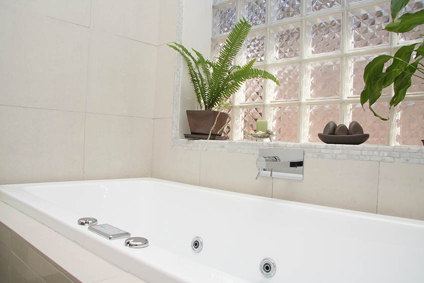 Bathtub with prism glass block windows