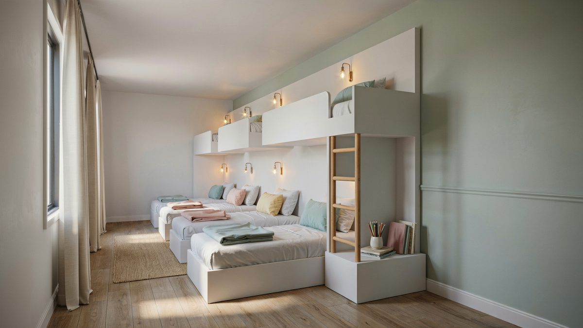 Row of built in bunk beds with reading lights and a wood ladder