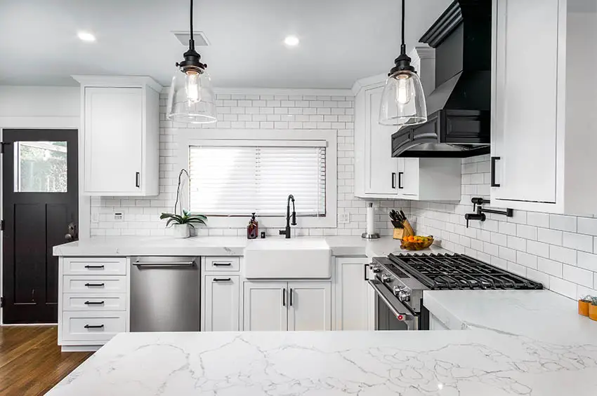 C shaped kitchen with quartz look countertops