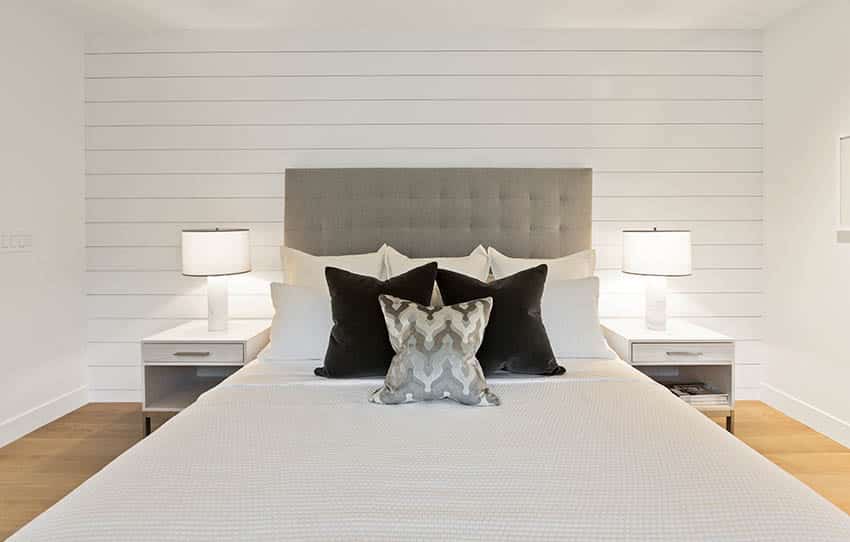 Contemporary bed with tufted headboard cotton sheets shiplap accent wall