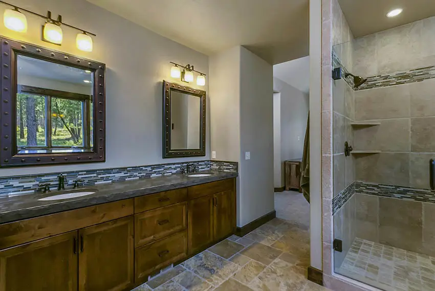 Craftsman master bathroom with dual vanity travertine shower flooring