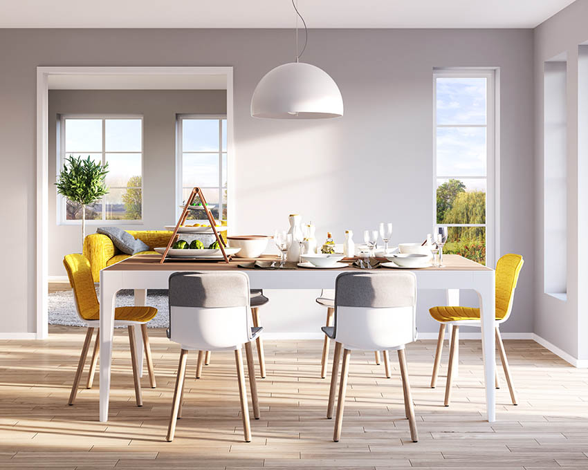 Dining room chairs with contrasting colors of yellow and gray
