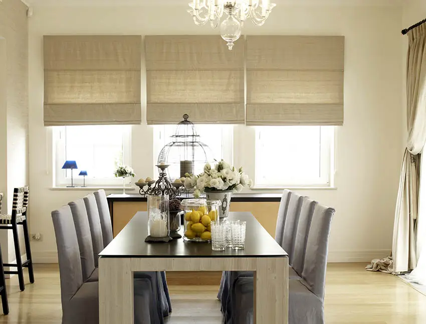 Fabric roman shades in dining room
