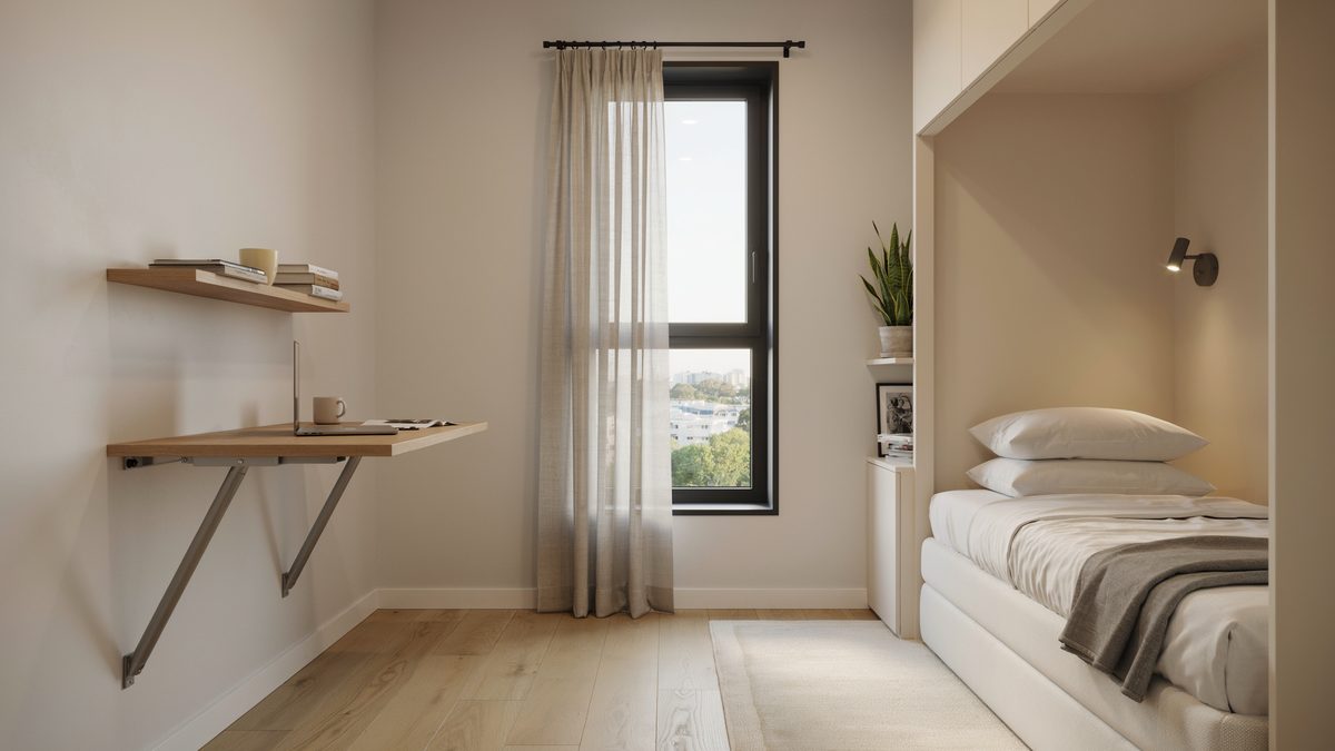 Wall mounted fold up desk beside an open murphy bed near a black window