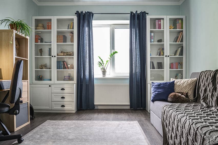 Home office with blue sheer curtains
