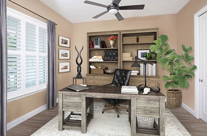 Home office with large wood desk light brown paint plantation shutters