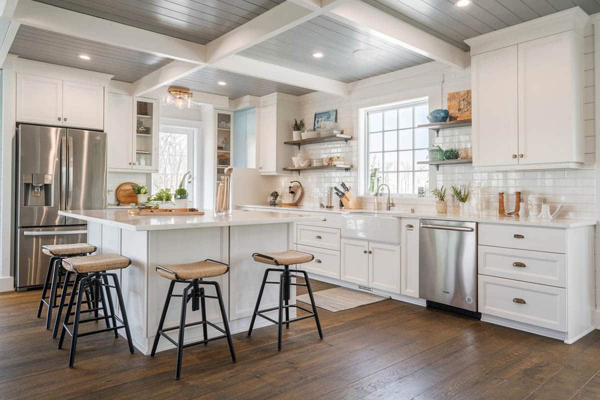 cottage kitchen with gray shiplap and white painted beams on the ceiling