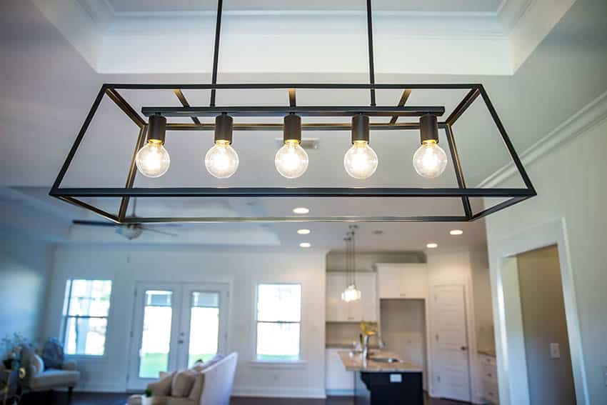 Linear lights above dining table