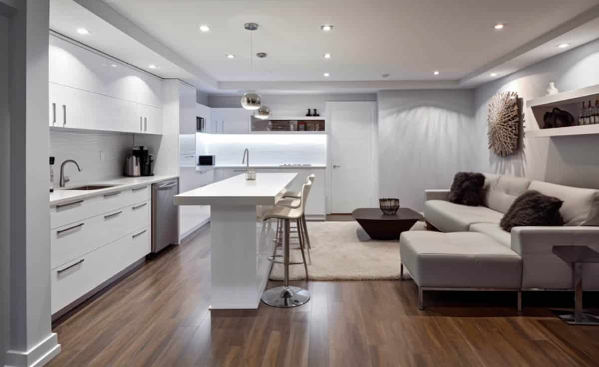 Modern l-shaped basement layout with acrylic cabinets and lounge seating