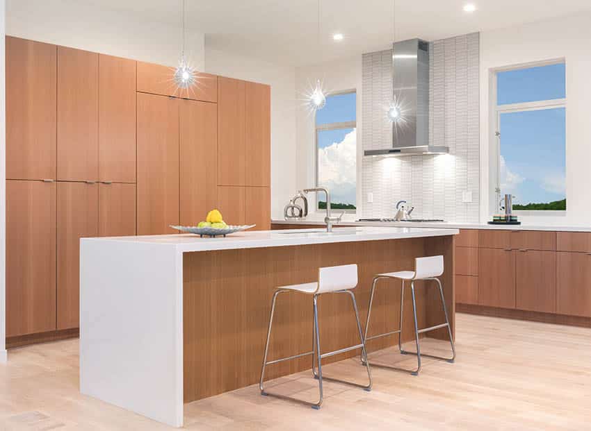 Kitchen with solid surface countertops and wood veneer cabinets