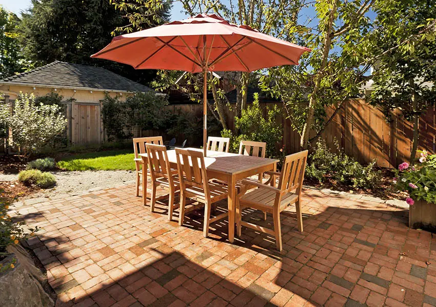 Paver patio with wood outdoor dining table
